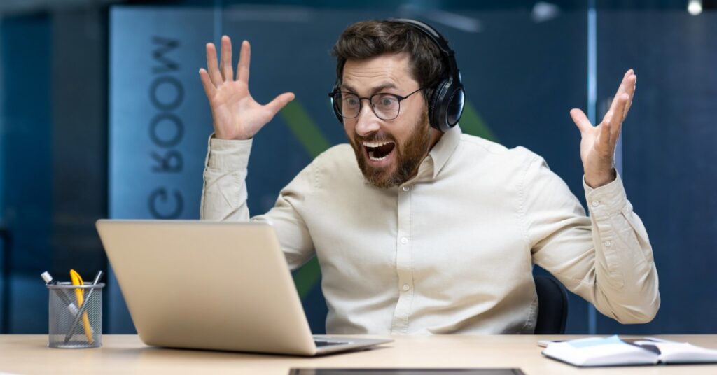 Employee reviewing a suspicious email on a laptop to promote cyber security awareness at work